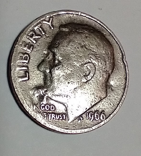 Looking-For-Thoughts-On-The-Curious-Surface-On-This-1966-Roosevelt-Dime